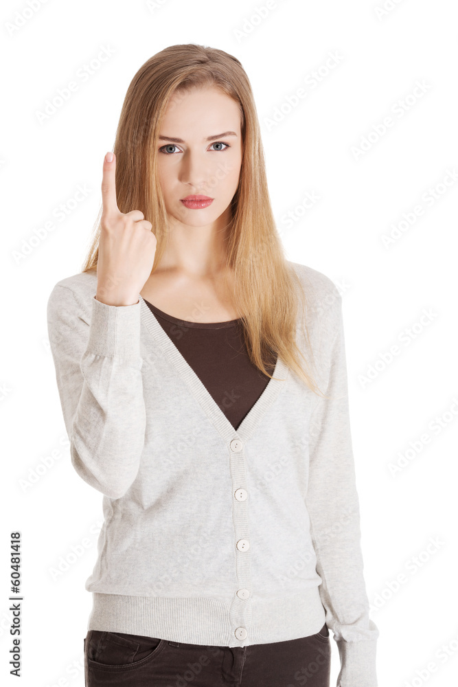 Beautiful woman is showing one finger in a warning. Beautiful woman is showing one finger in a warning.