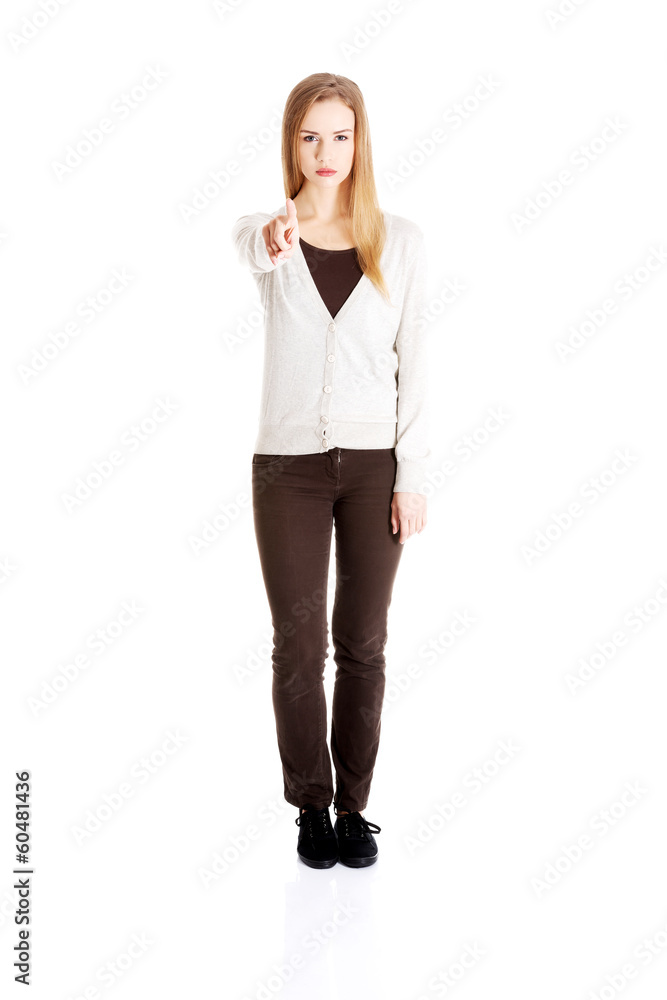 Beautiful casual woman pointing on you and warning or accusing o Beautiful casual woman pointing on you and warning or accusing o