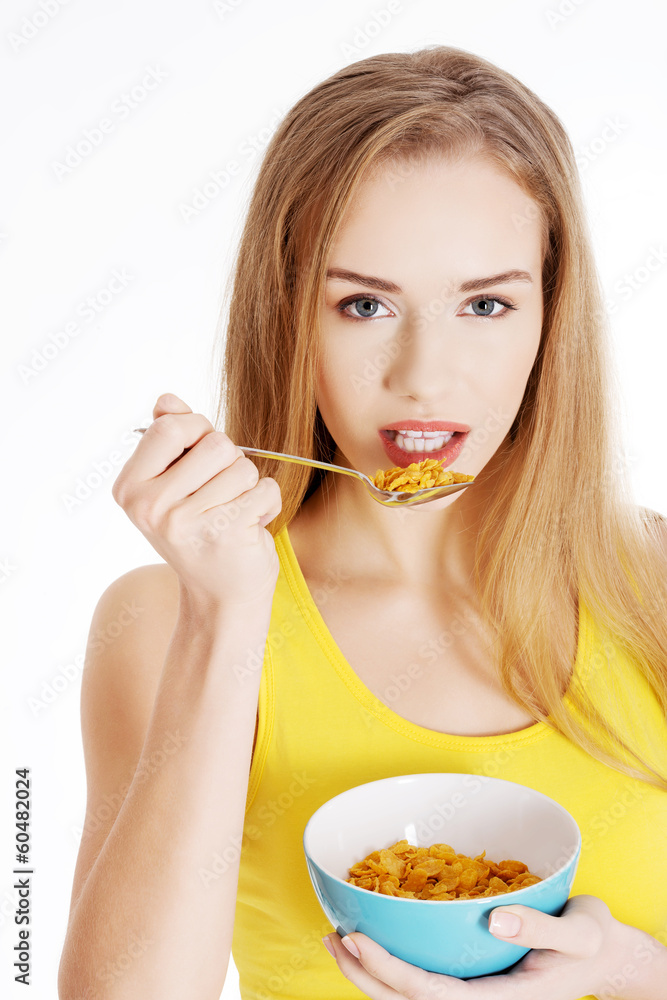 Beautiful caucasian woman eating cereals. Beautiful caucasian woman eating cereals.