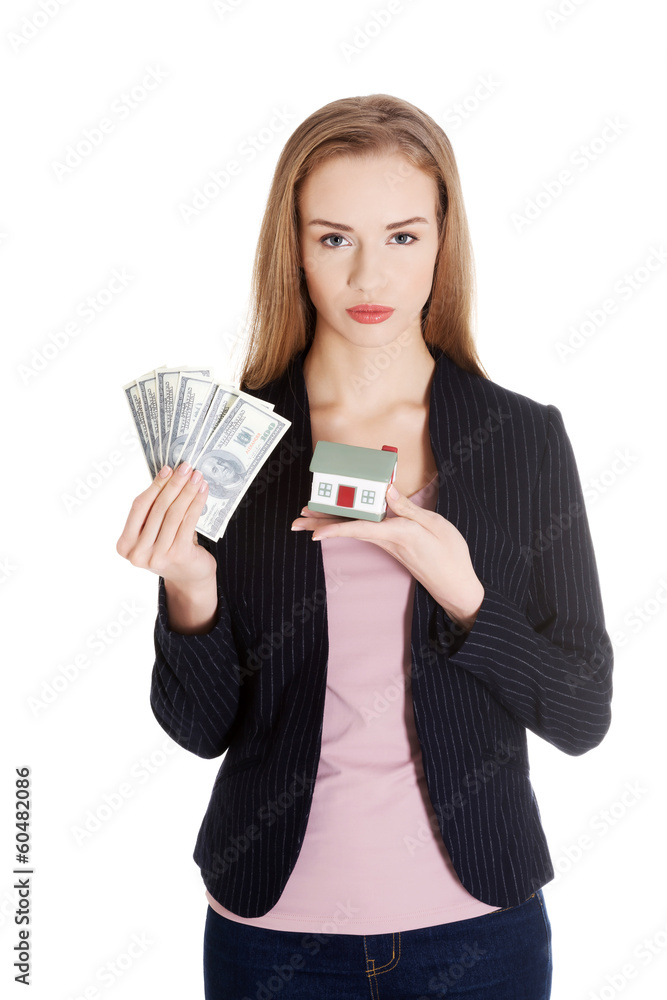 Beautiful business woman holding hpuse and dollars money. Beautiful business woman holding hpuse and dollars money.