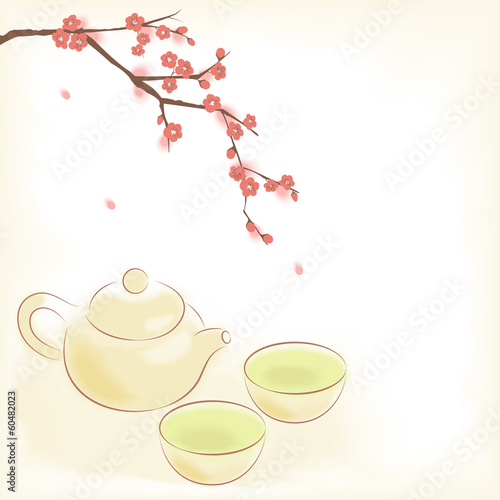 Traditional oriental teapot and cups with plum blossom