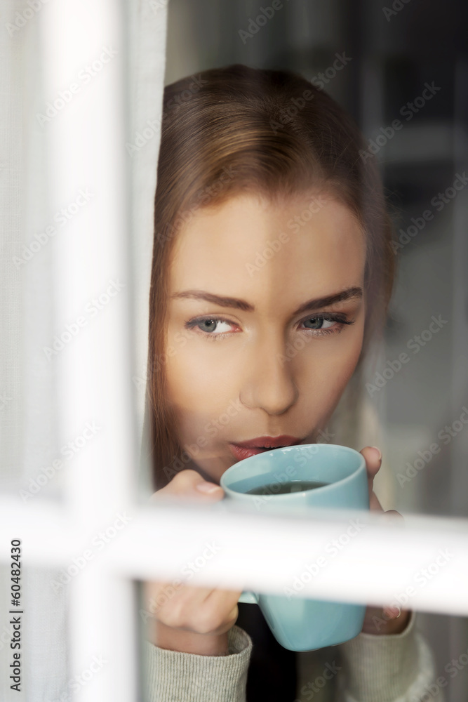 Beautiful caucasian woman drinking hot coffee or tea. Beautiful caucasian woman drinking hot coffee or tea.