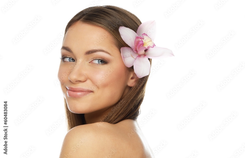 Young beautiful brunette woman with orchid flower Young beautiful brunette woman with orchid flower