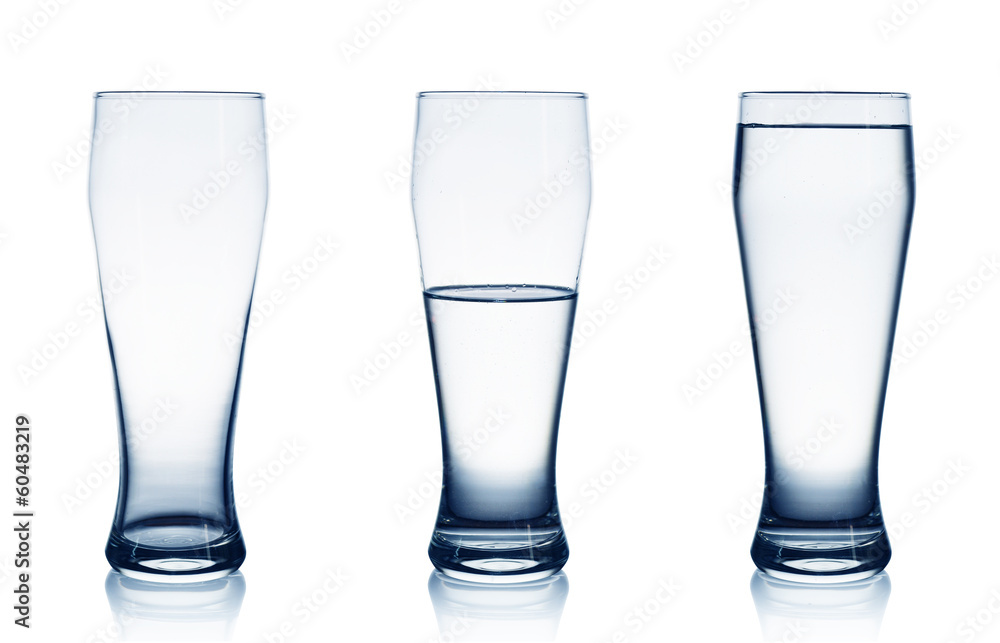 Isolated on white empty, half and full water glasses