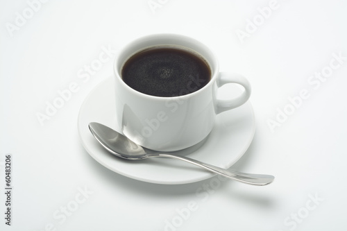 Taza de caf   con cucharilla en un plato