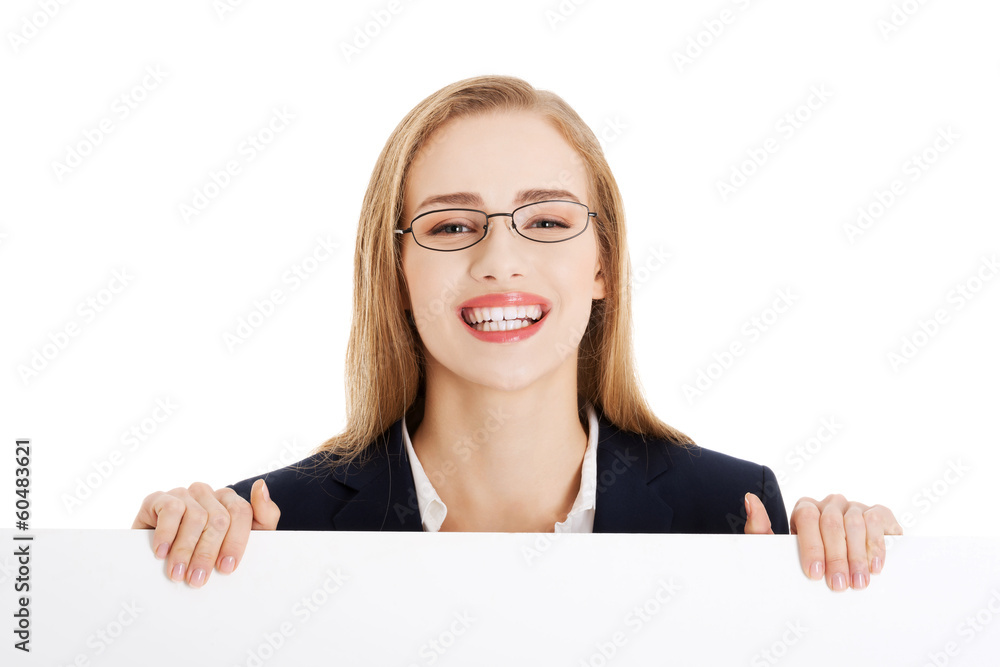 Beautiful business woman holding empty board, copy space. Beautiful business woman holding empty board, copy space.