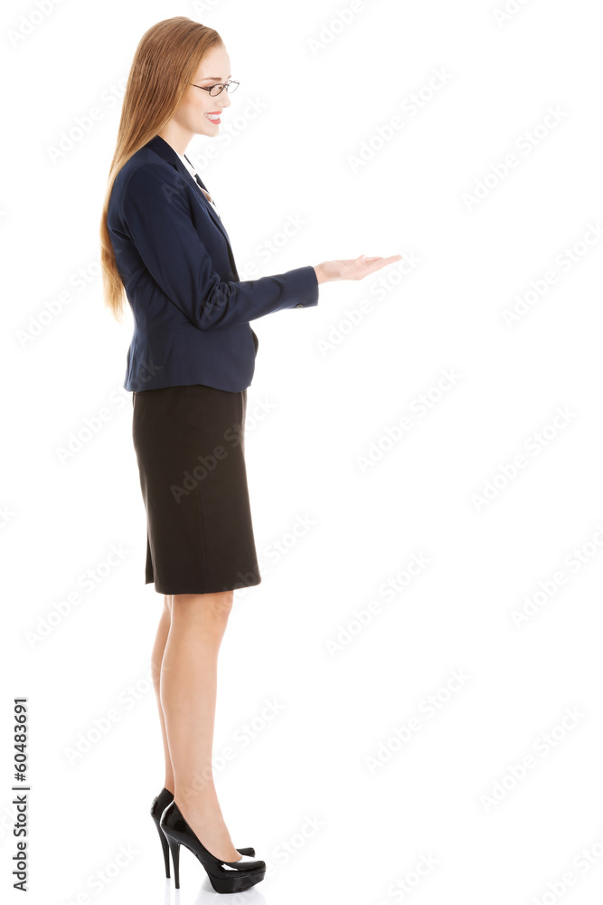 Beautiful business woman with copy space on her hand. Beautiful business woman with copy space on her hand.