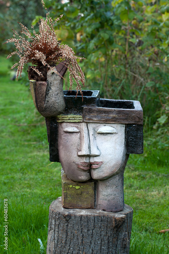 the flower pot in the form of the feminine head photo