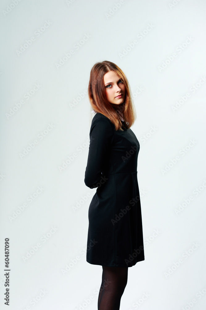 thoughtful woman in formal dress on gray background thoughtful woman in formal dress on gray background