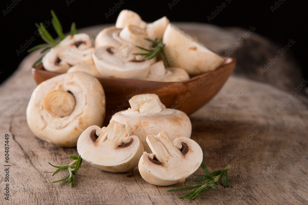 Fresh champignon mushrooms on wood Fresh champignon mushrooms on wood