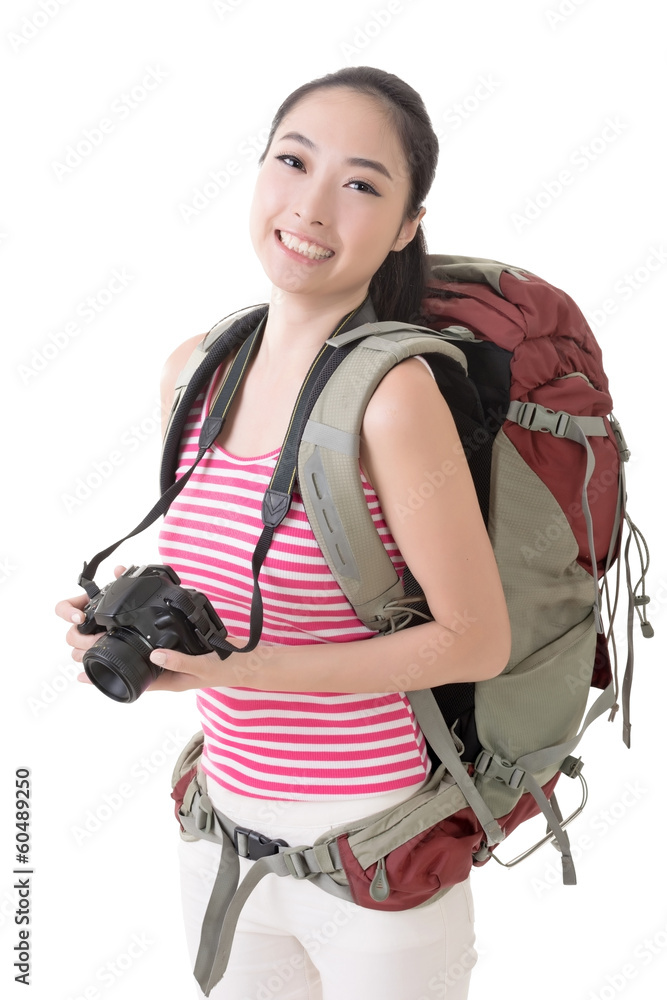 Smiling traveling Asian girl holding a camera Smiling traveling Asian girl holding a camera