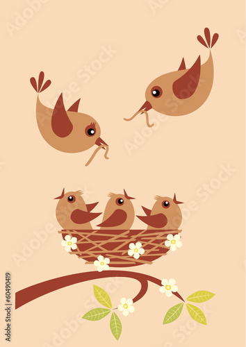Cute little birds in a nest and their parents with worms