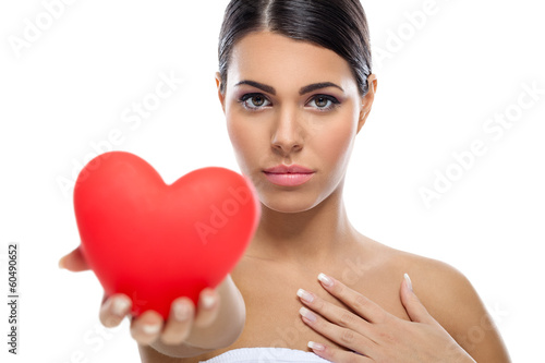 Young woman giving heart