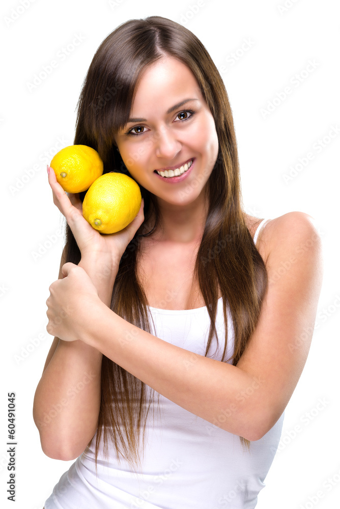Healthy lifestyle - Beautiful pretty woman is holding two lemons Healthy lifestyle - Beautiful pretty woman is holding two lemons