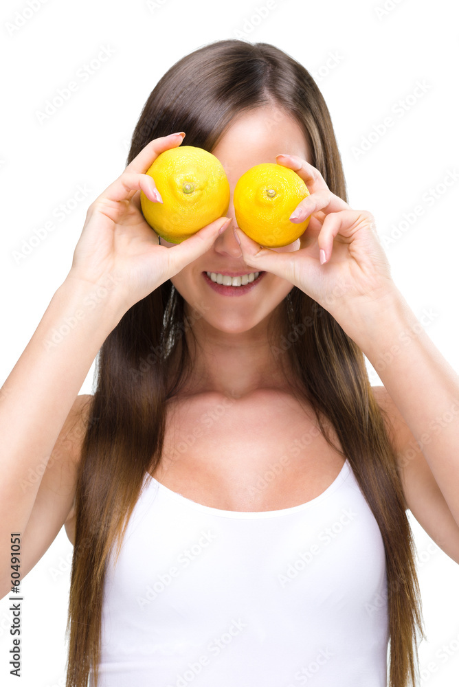 Healthy lifestyle - Fitt woman , before the eyes of two lemons Healthy lifestyle - Fitt woman , before the eyes of two lemons