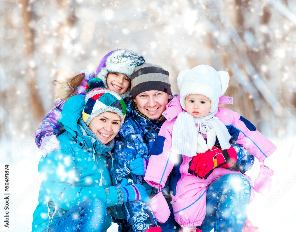 Winter portrait of happy young family