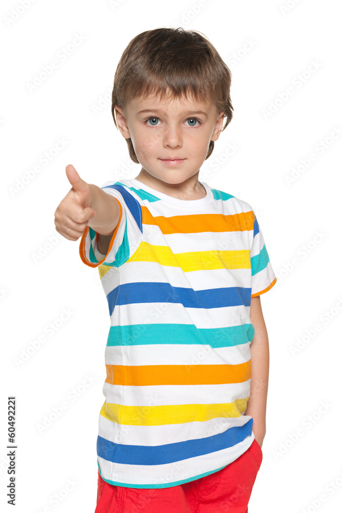 Cute little boy holds his thumb up Cute little boy holds his thumb up