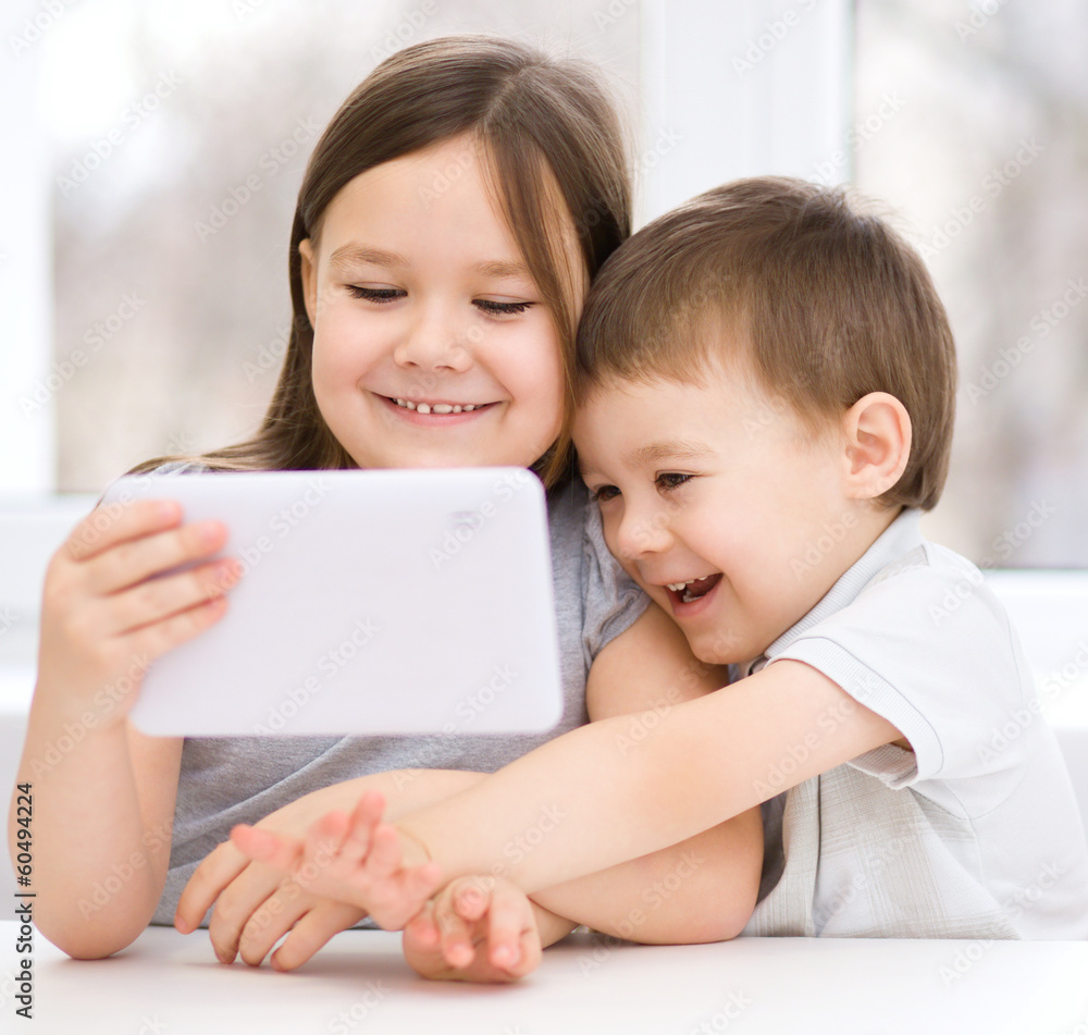 Children using tablet computer Children using tablet computer