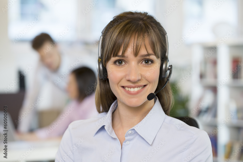 Portrait of cute Businesswoman in the office on phone, headset Portrait of cute Businesswoman in the office on phone, headset