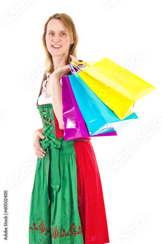 Bavarian woman in dirndl on shopping tour