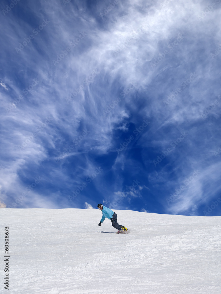 Snowboarder on off-piste ski slope
