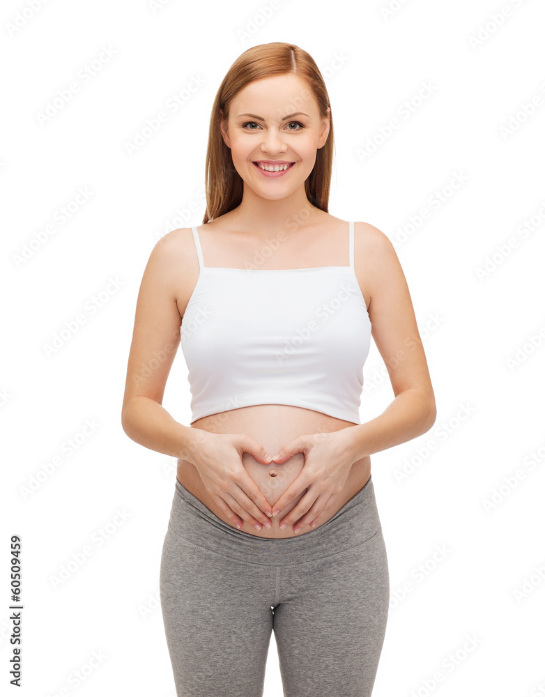 happy future mother showing heart with her hands happy future mother showing heart with her hands