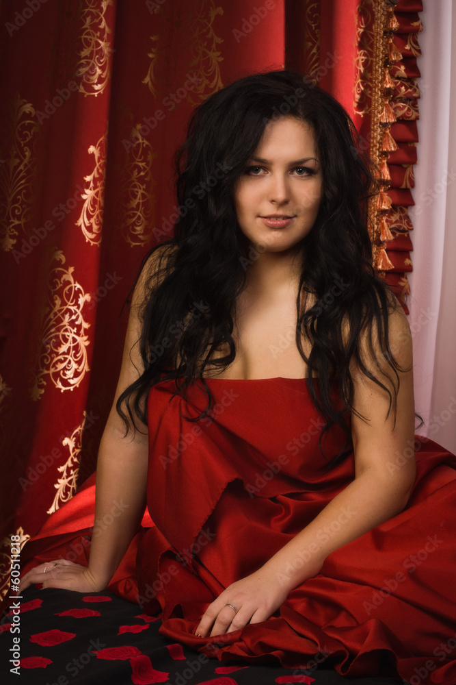 Fototapeta premium sexy brunette in the bedroom