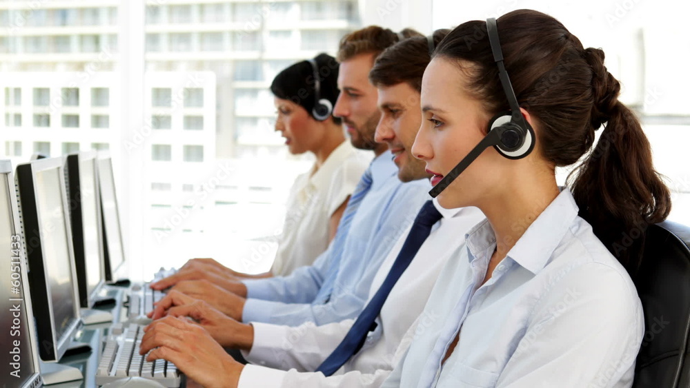Happy call centre agent looking to camera Happy call centre agent looking to camera