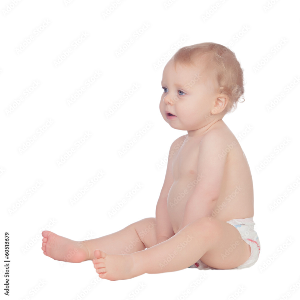 Adorable blonde baby in diaper sitting on the floor Adorable blonde baby in diaper sitting on the floor