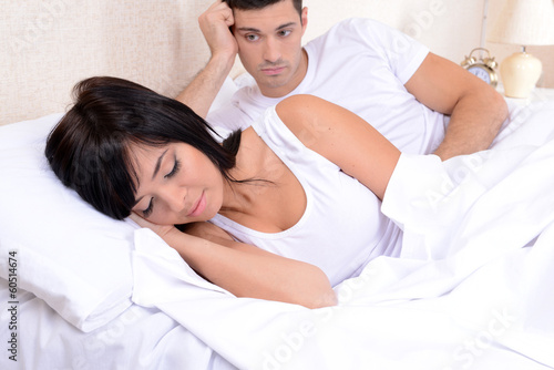 Couple in love sleeping in bed