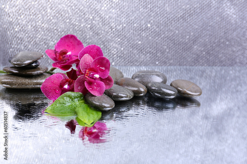 Fototapeta Naklejka Na Ścianę i Meble -  Composition with beautiful blooming orchid with water drops and