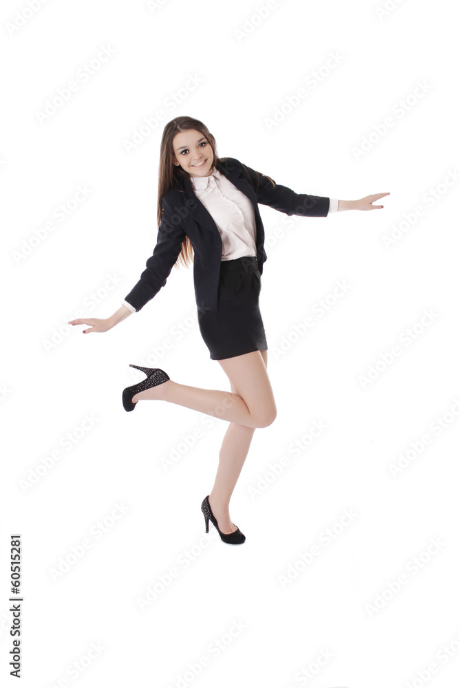 Joyful student girl in uniform dancing