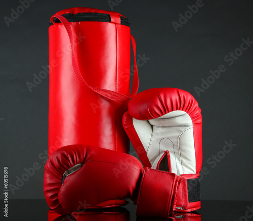 Konstfotografi Boxing gloves and punching bag, isolated on black