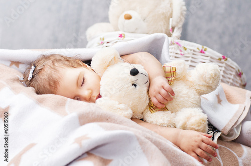 sleeping girl with a toy