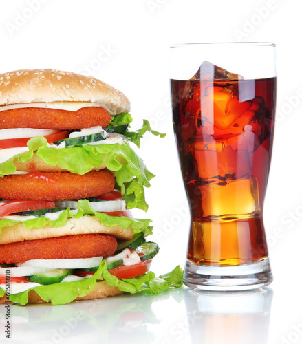 Huge burger and glass of cold drink, isolated on white