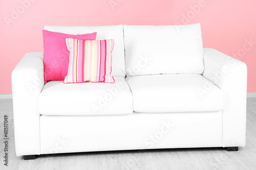 White sofa in room on pink background