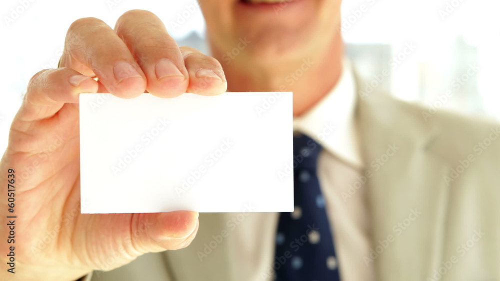 Businessman showing his card to camera Businessman showing his card to camera
