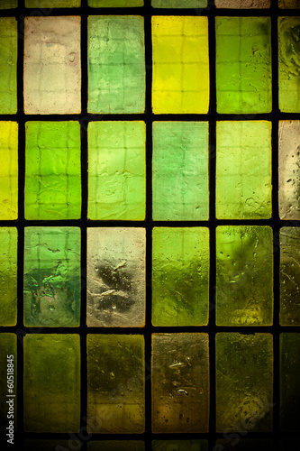 green glass window with regular block pattern green tone