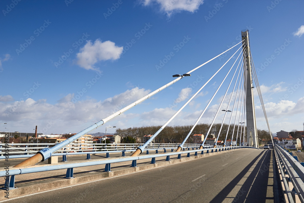 suspension bridge against the blue sky