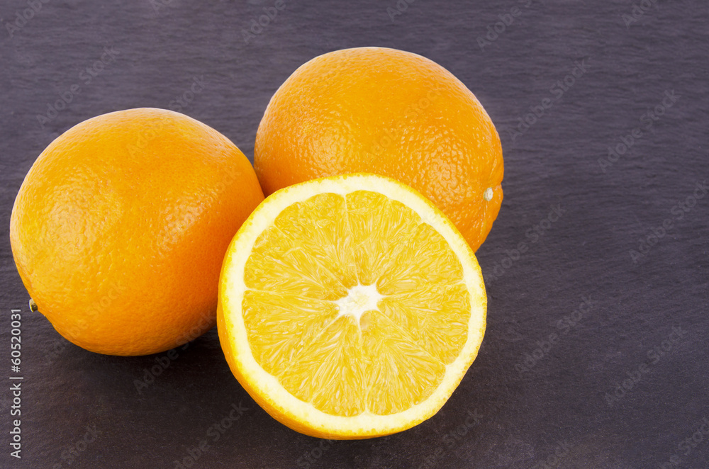 Orange fruits on slate Orange fruits on slate