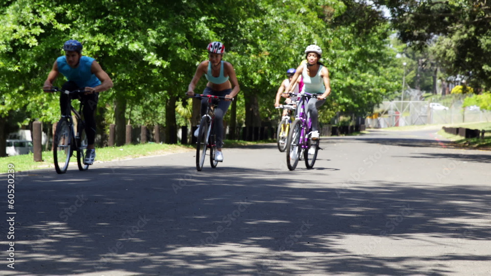 Friends riding their bikes together Friends riding their bikes together