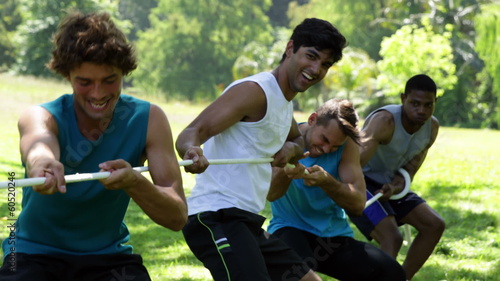 Men pulling a rope in a tug of war