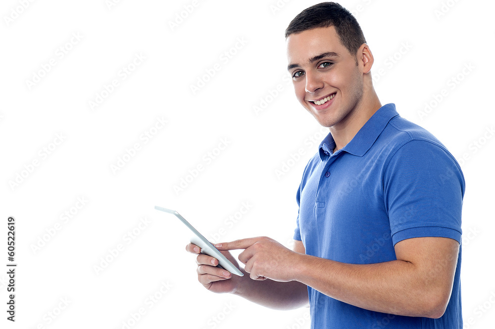 Young guy using tablet pc