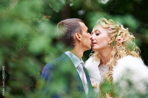 Romantic kiss bride and groom © Sergey Ryzhov