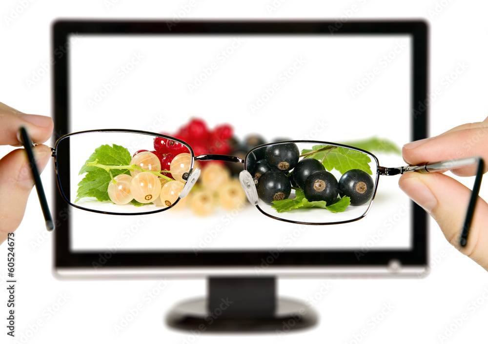Man is viewing to currants with leaves on display Man is viewing to currants with leaves on display