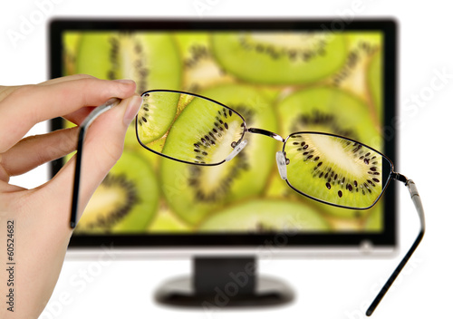 Man is viewing to kiwi on display