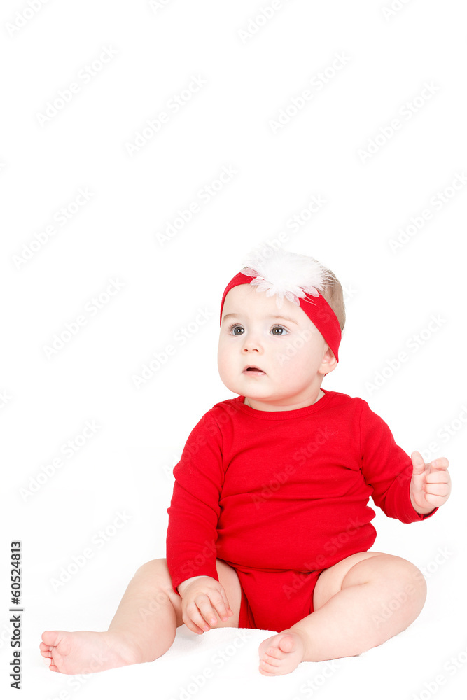 Portrait of a little girl sitting on a white background Portrait of a little girl sitting on a white background