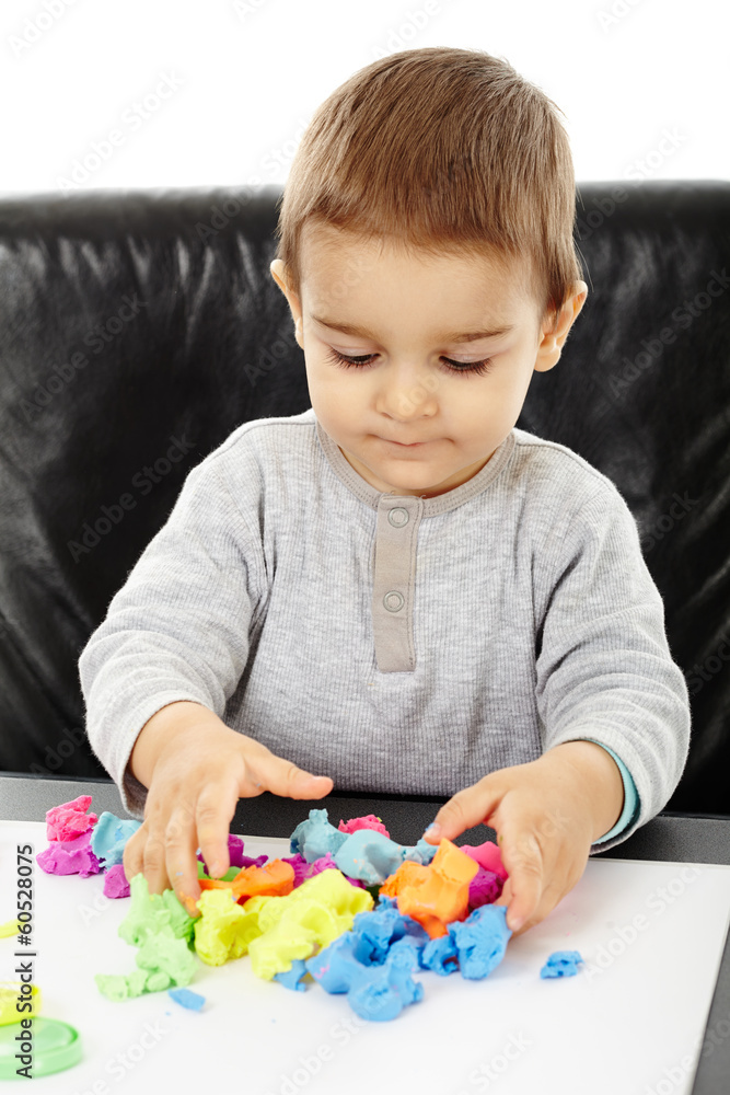 Little boy playing with plasticine Little boy playing with plasticine