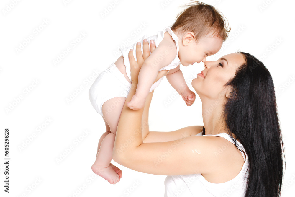 Portrait of mother and baby kissing, laughing and hugging Portrait of mother and baby kissing, laughing and hugging