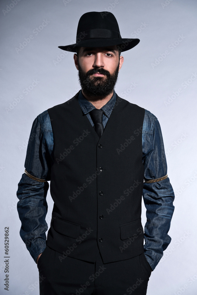 Retro hipster 1900 fashion man in suit with black hair and beard Retro hipster 1900 fashion man in suit with black hair and beard